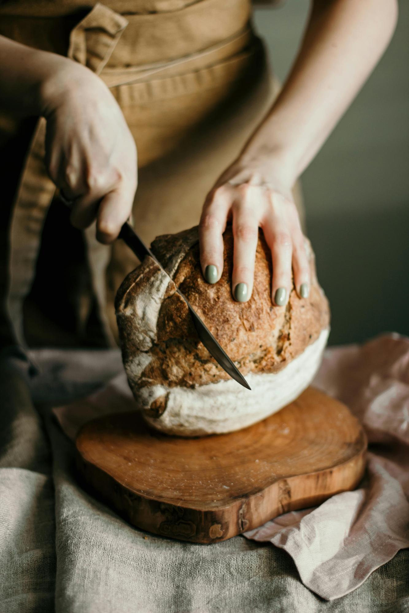 close-up of artisanal bread and hands